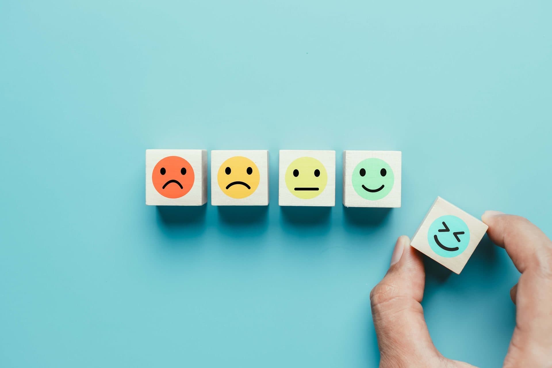Wooden blocks showing a range of facial expressions
