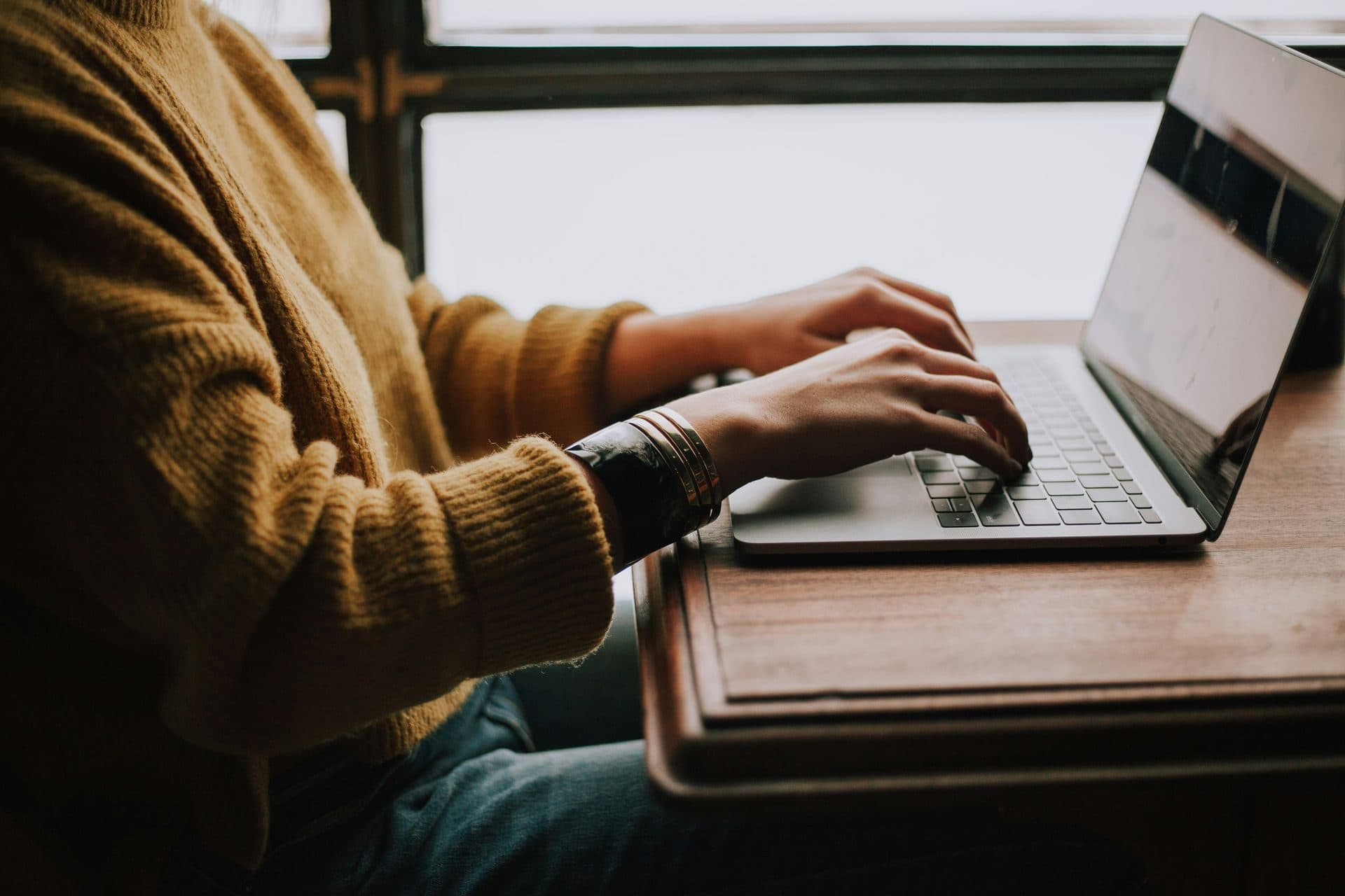 A person reviewing information on a laptop